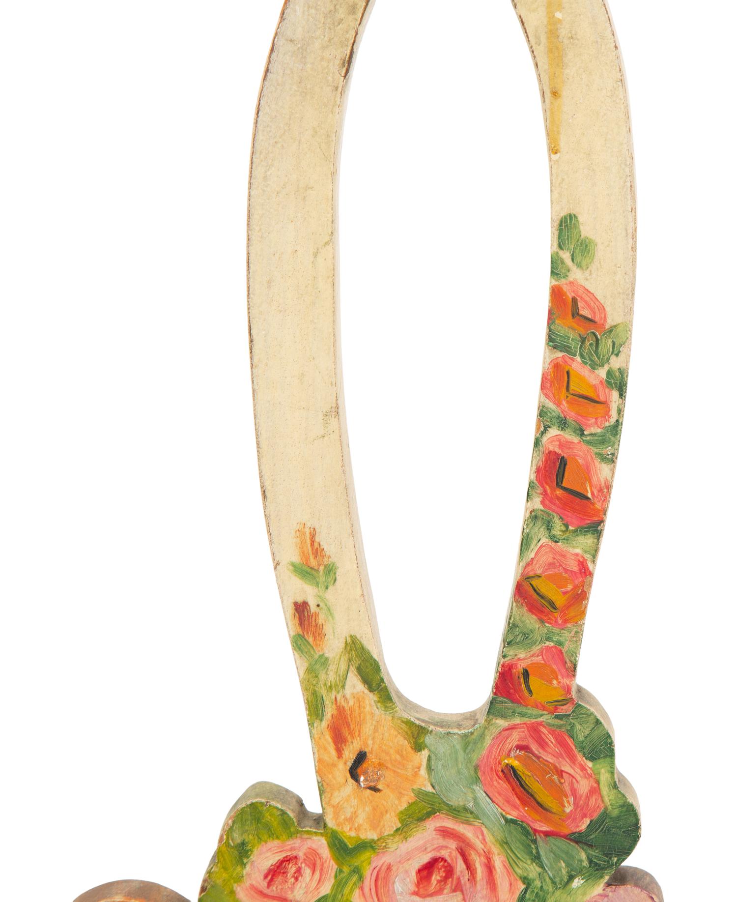 A Victorian Painted Iron Greyhound Doorstop and a Painted Wood Basket Doorstop