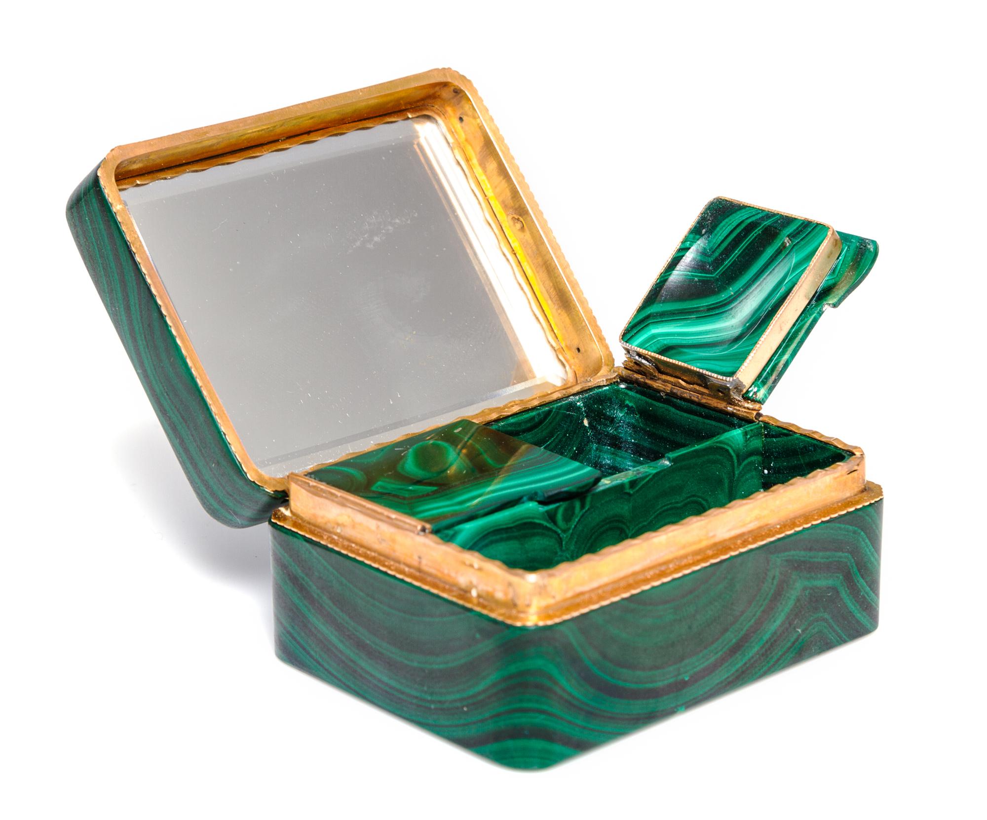A French Gilt Metal Mounted Malachite Powder Box, 19th/20th Century, of rectangular form with a hinged lid opening to a mirrored interi