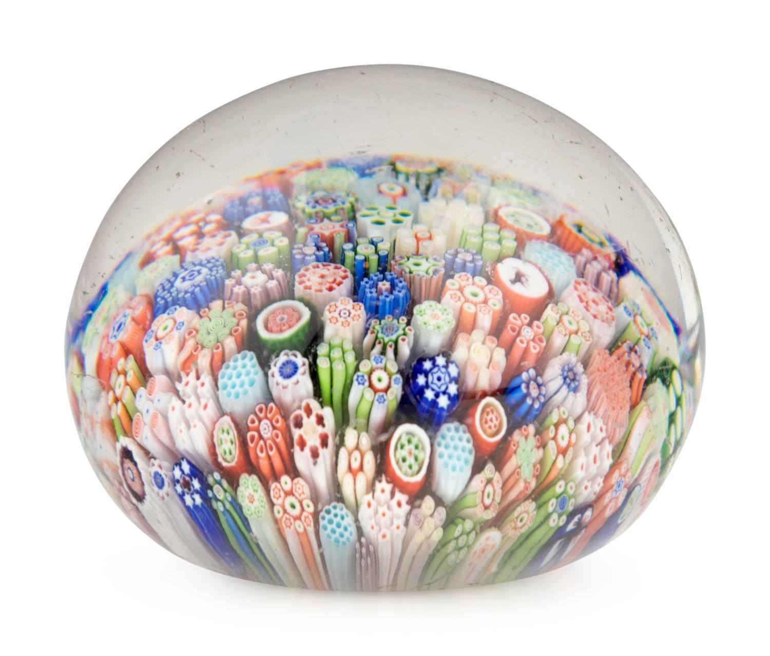 A Miniature Baccarat Close Packed Millefiori and Silhouette Glass Paperweight