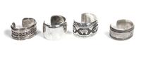 Four Southwestern Silver Bracelets Length of one 5 5/8 x opening 1 1/4 x width 1 1/2 inches