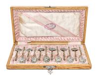 A Set of Twelve Russian Enameled Silver-Gilt Spoons, Mark of Vasiliy Agafonov, Moscow, late 19th/early 20th century, each having a twis