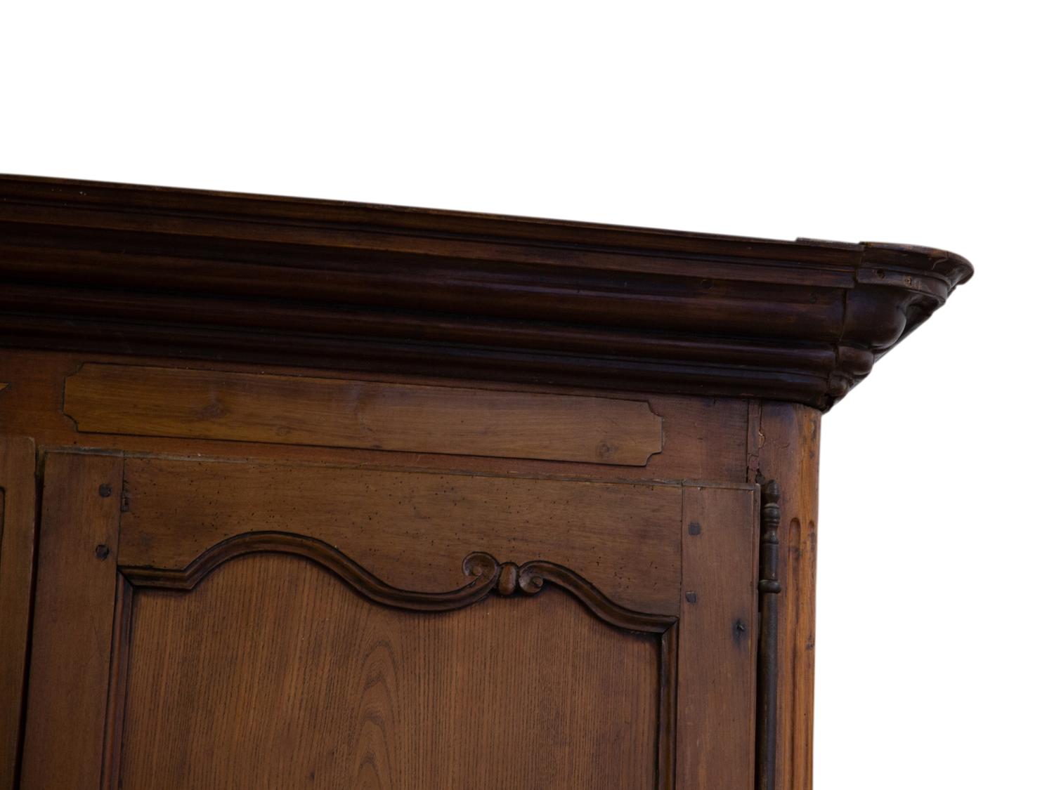 A French Provincial Carved Walnut Armoire