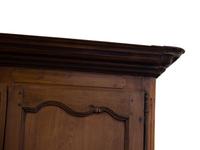 A French Provincial Carved Walnut Armoire