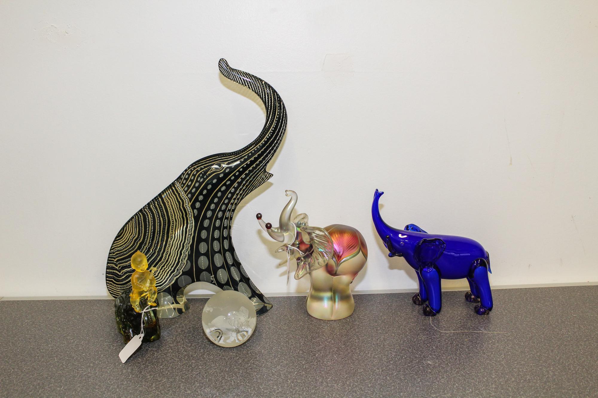 A Group of Four Glass Elephant Articles Height of tallest 8 inches.