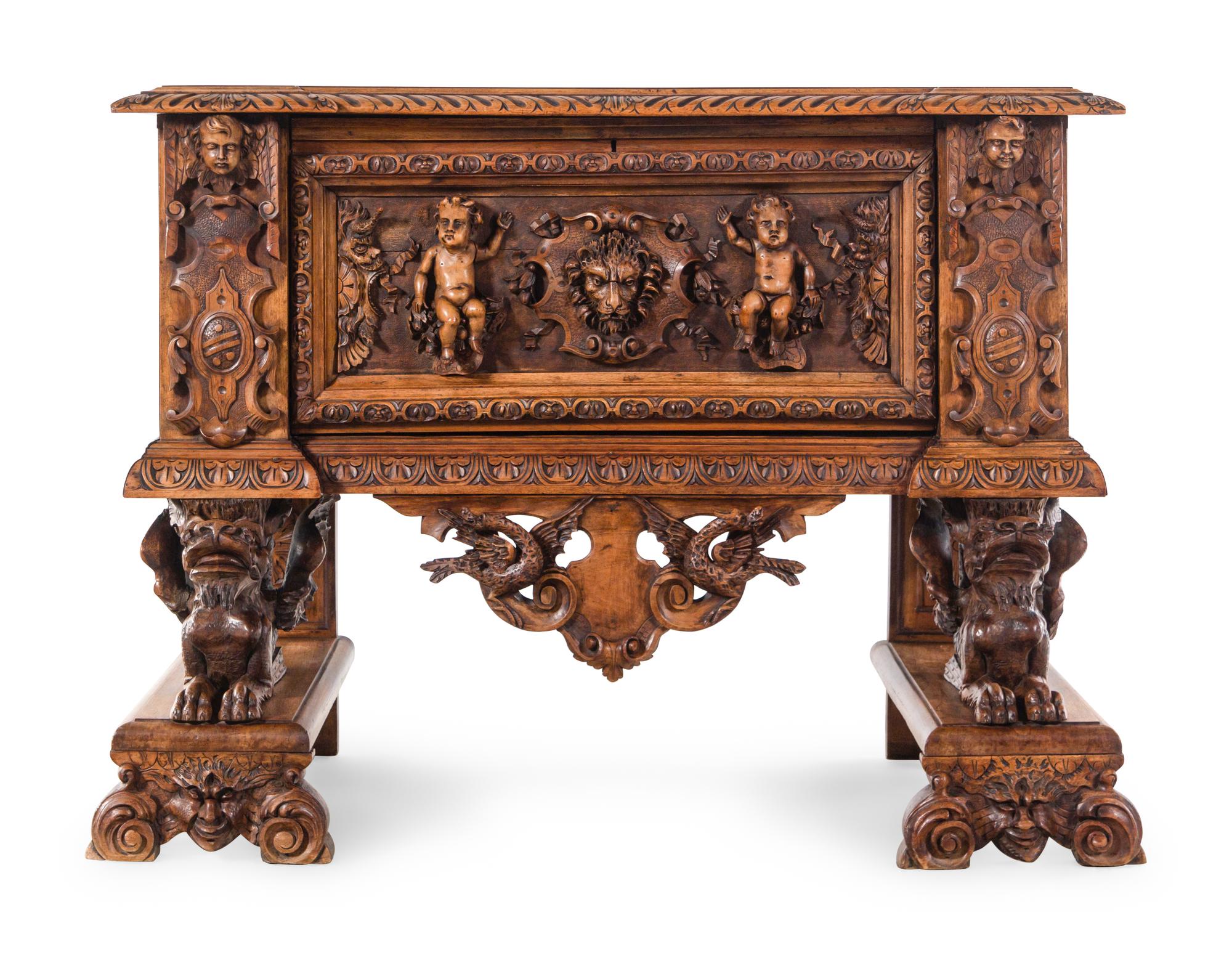 An Italian Renaissance Revival Carved Walnut Cassone on Stand