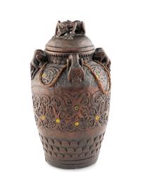 An Oceanic Carved Wood Lidded Vessel