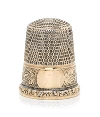 An American 14-Karat Gold Thimble, Simons Bros., Philadelphia, PA, the knurled top and body above a volute decorated band with a vacant