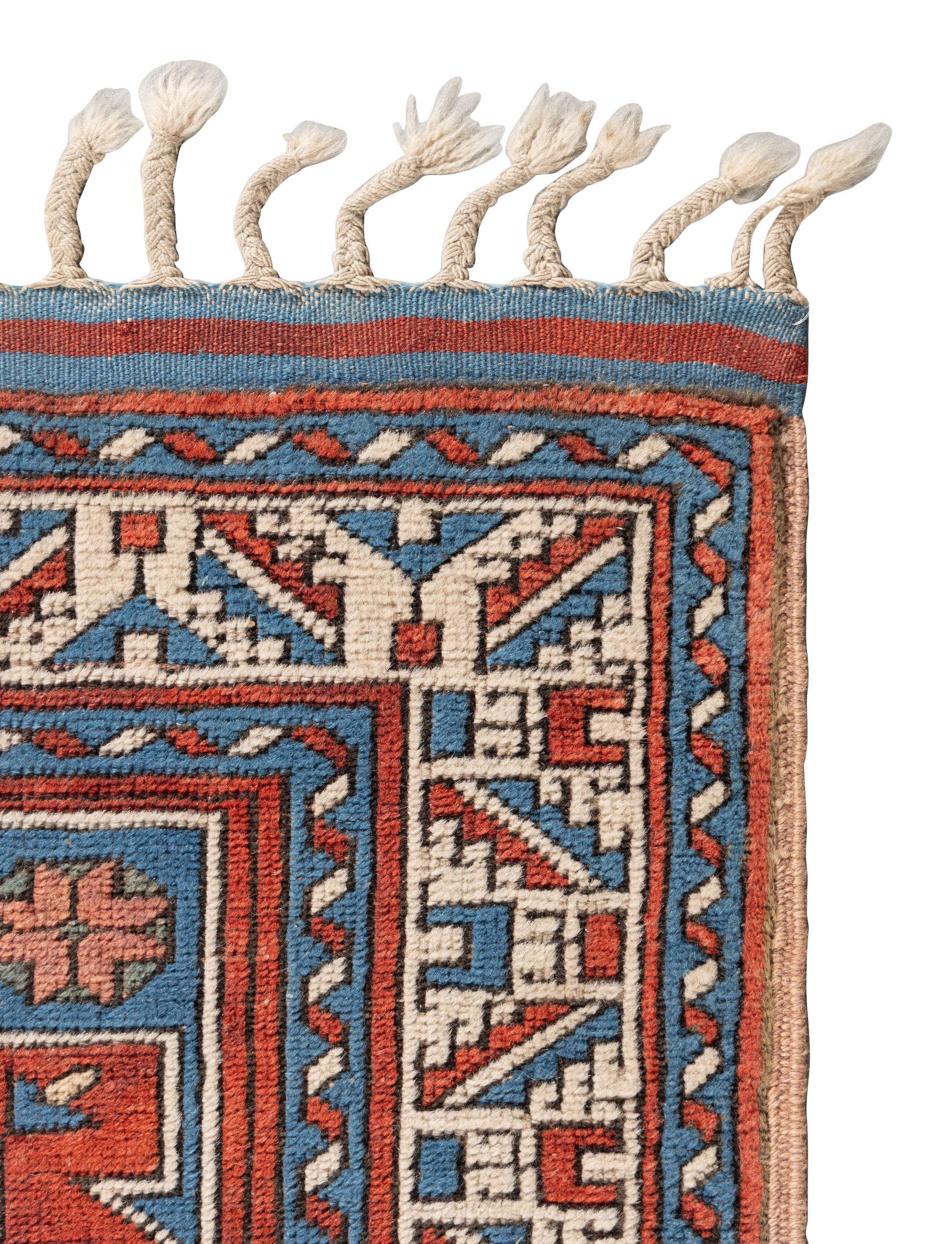 Two Caucasian Style Rugs