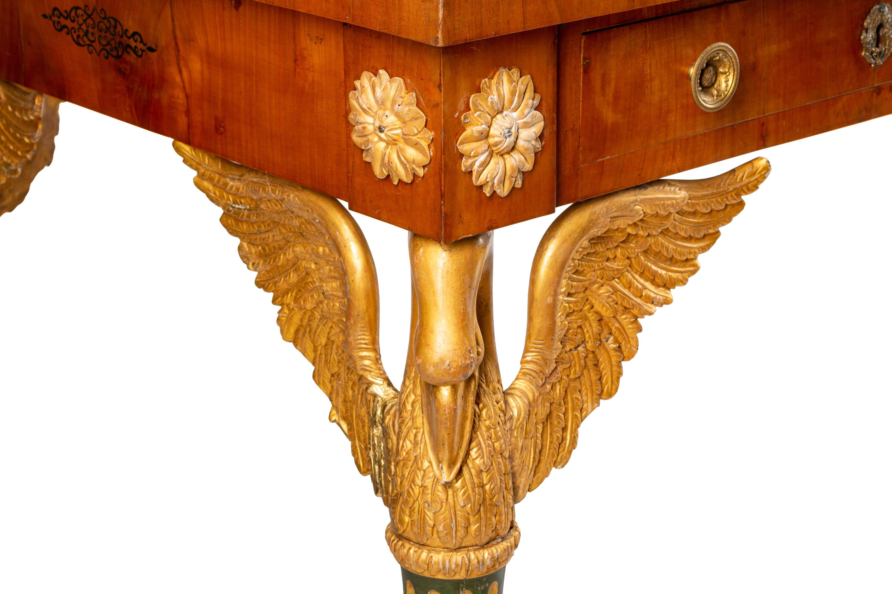 An Austrian Empire Style Fruitwood Veneered, Painted and Parcel Gilt Bureau Plat