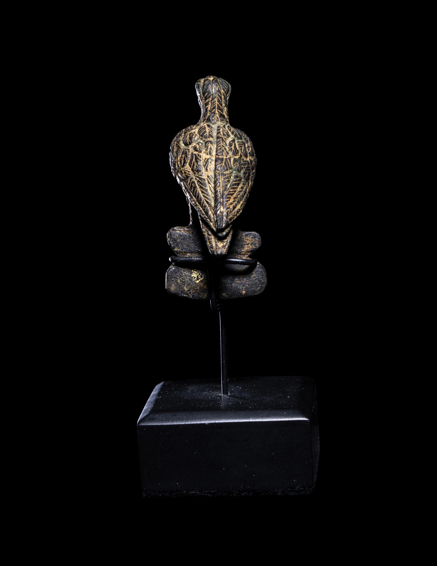 A Roman Bronze Eagle Perched on a Boar's Head
