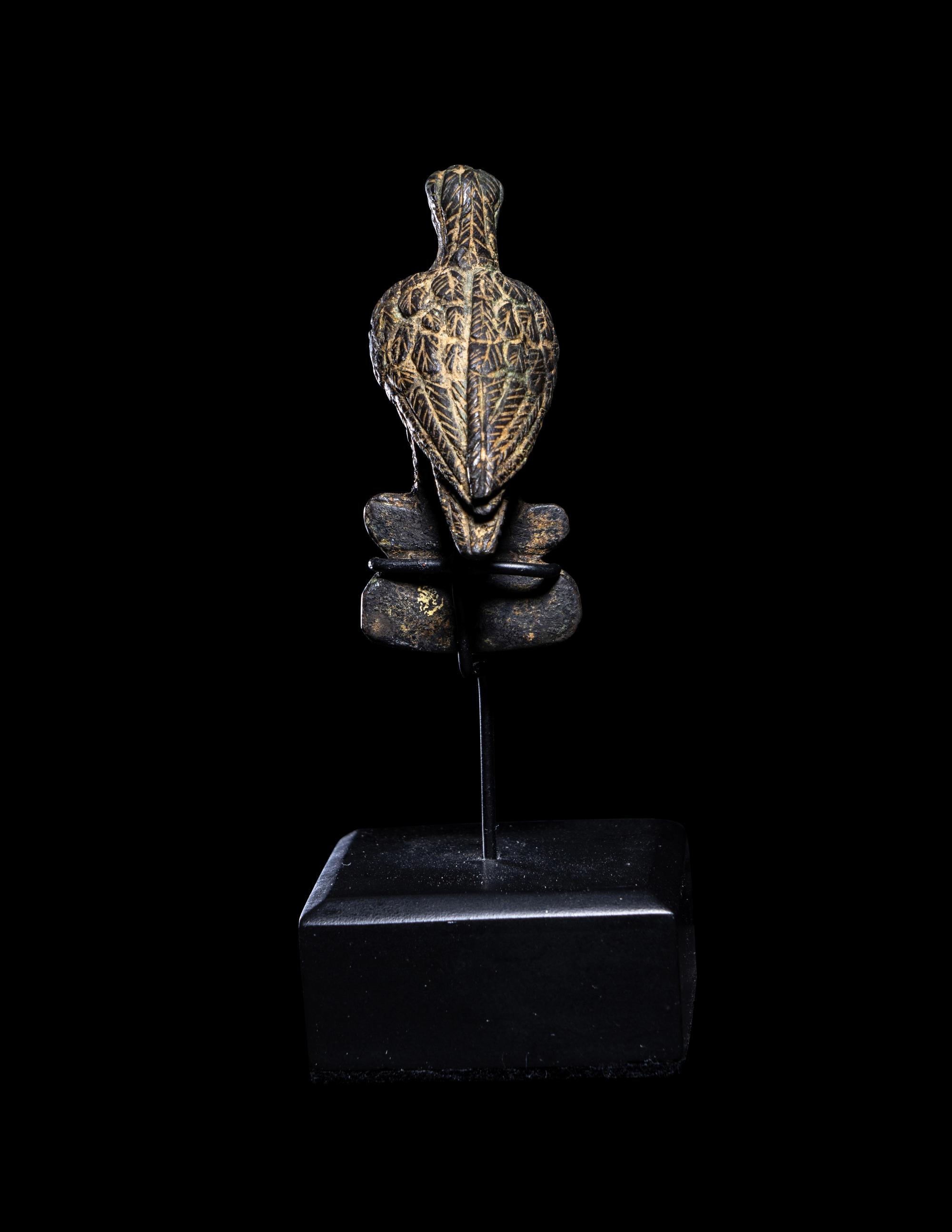 A Roman Bronze Eagle Perched on a Boar's Head