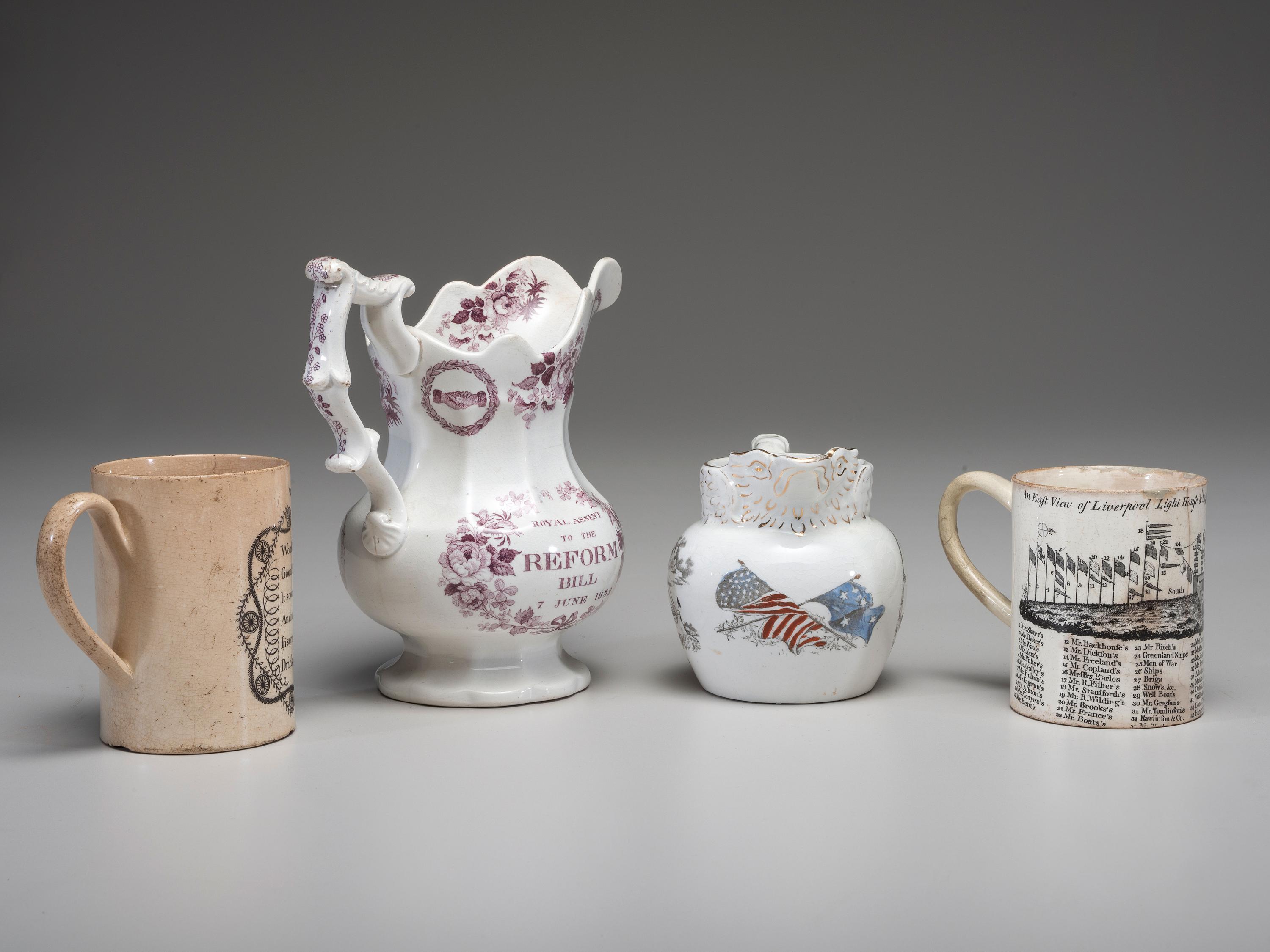Two Commemorative Creamware Pitchers and Two Ale Mugs