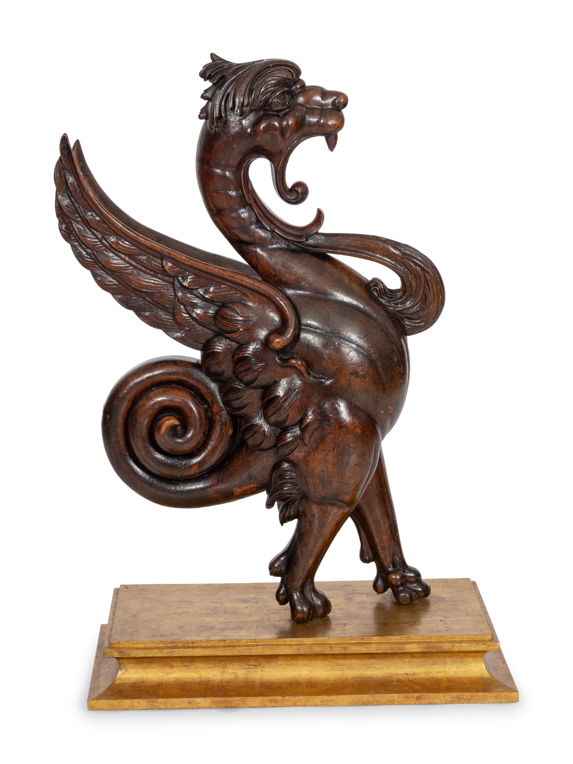 An American Carved Walnut Griffin Newel Figure