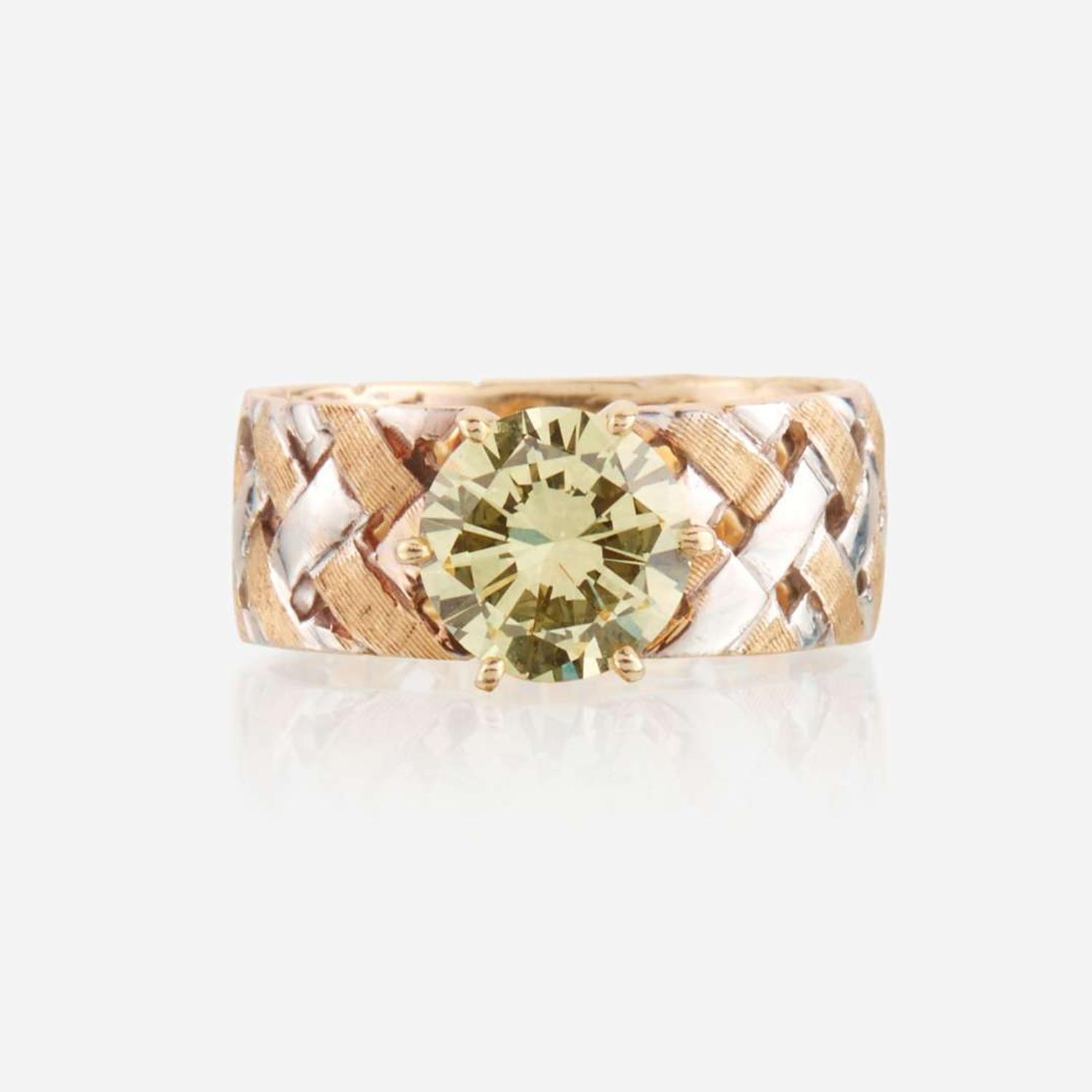 A colored diamond and bicolor gold ring