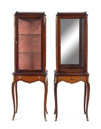 A Near Pair of Louis XV/XVI Transitional Style Gilt Metal Mounted Vitrines