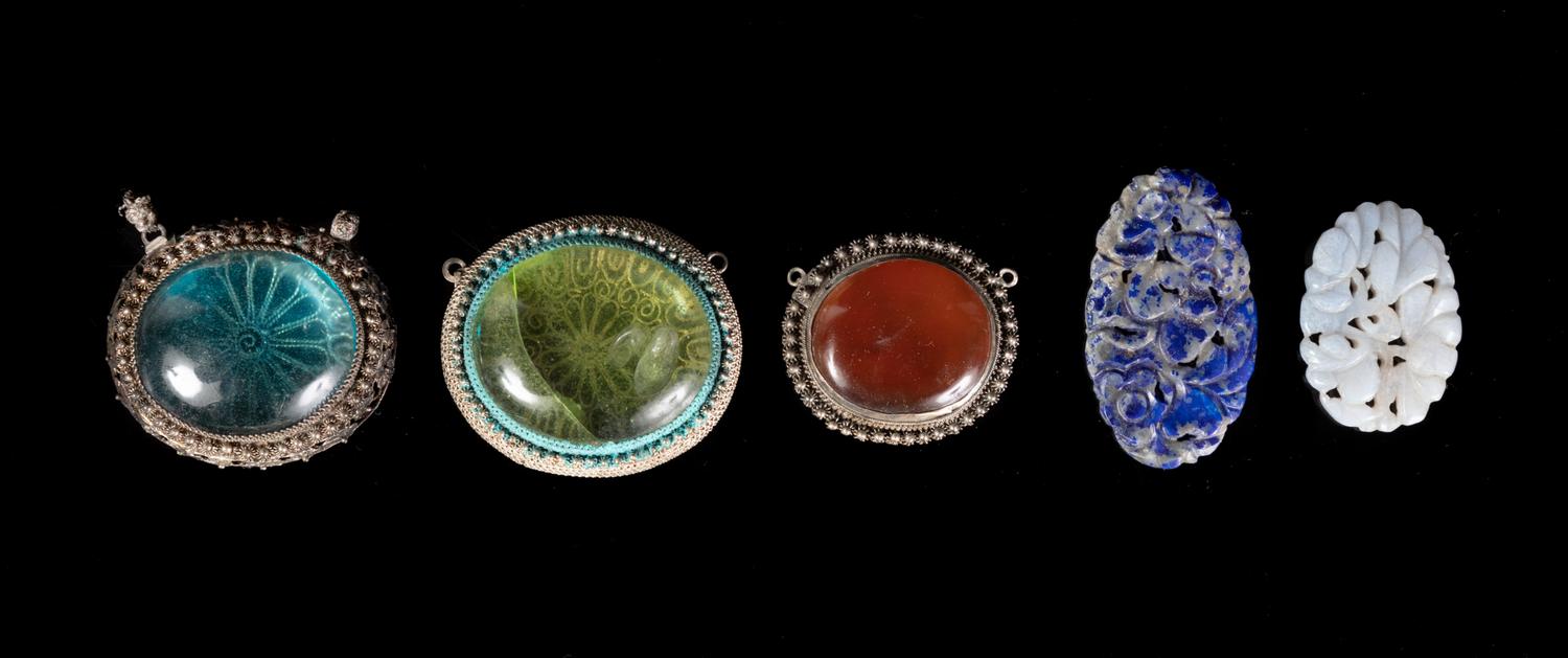 Seventy Chinese Hardstone and Glass Pendants
