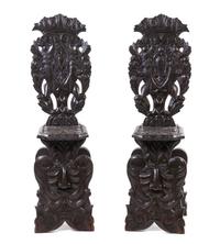A Pair of Renaissance Revival Carved Oak Hall Chairs, Height 49 1/2 inches.