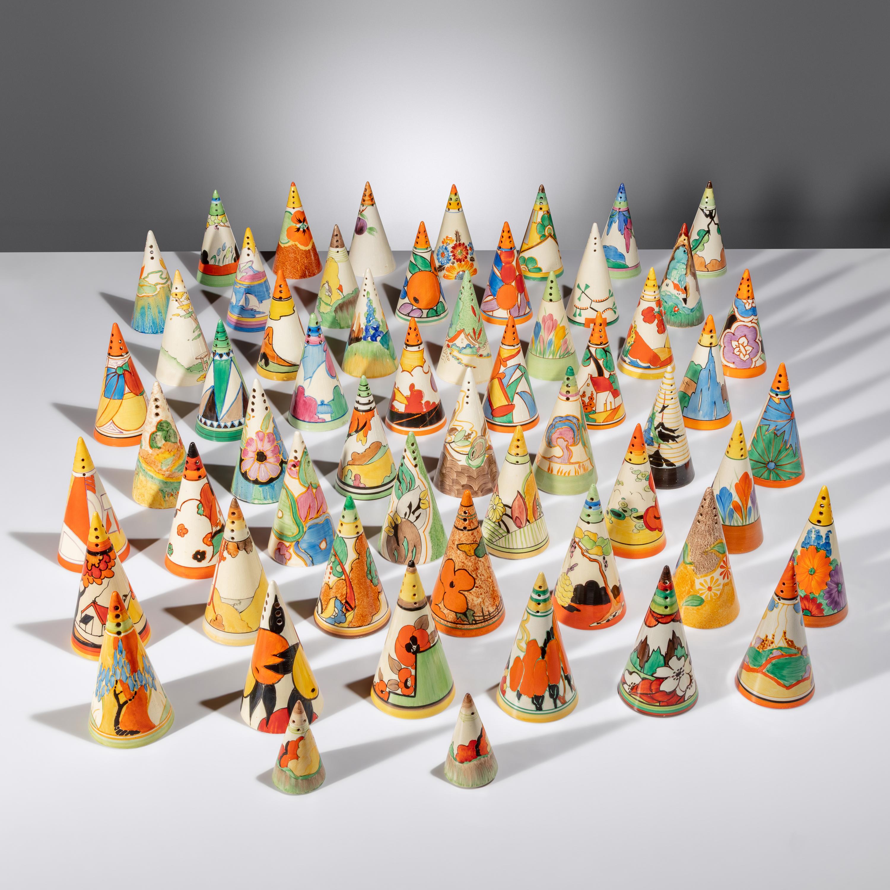 Clarice Cliff (English, 1899–1972) — Collection of 57 Conical Sugar Shakers and Custom Case