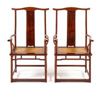 A Pair of Chinese Huanghuali Official's Hat Armchairs, Sichutouguanmaoyi Each height 44 3/4 x width 24 1/2 x depth 20 inches. — QING DYNASTY (1644-1911)