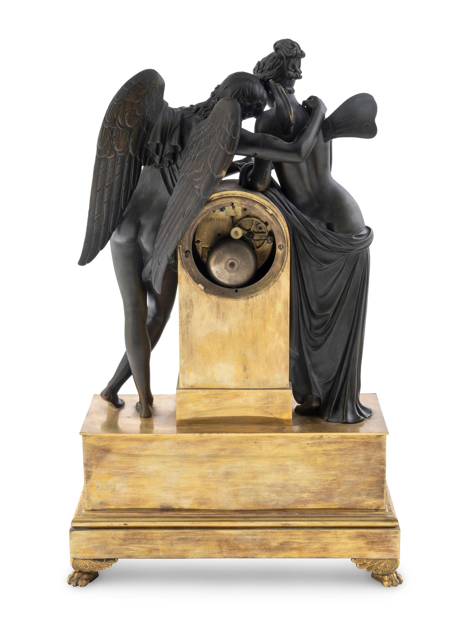 An Empire Bronze Clock Depicting Cupid and Psyche