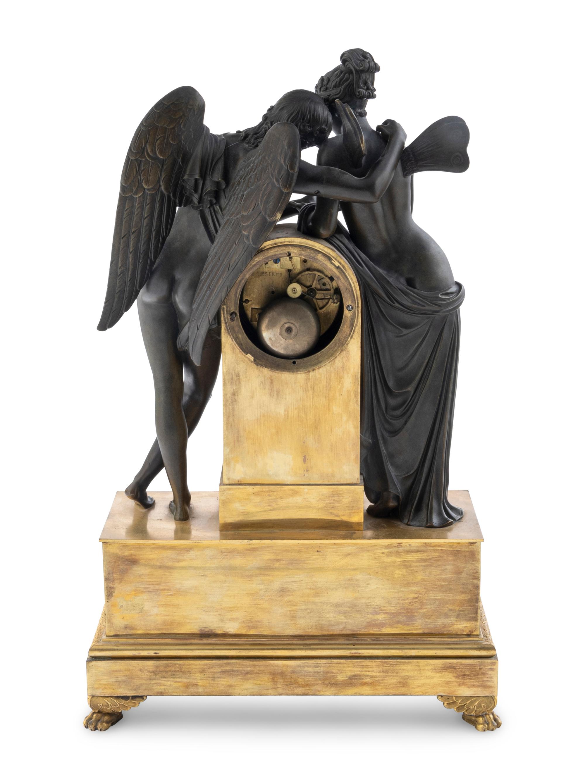 An Empire Bronze Clock Depicting Cupid and Psyche