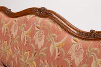 A Louis XV Provincial Carved Walnut Canapé — 19TH CENTURY