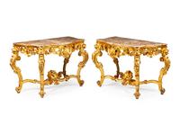 A Pair of Italian Parcel Gilt Console Tables