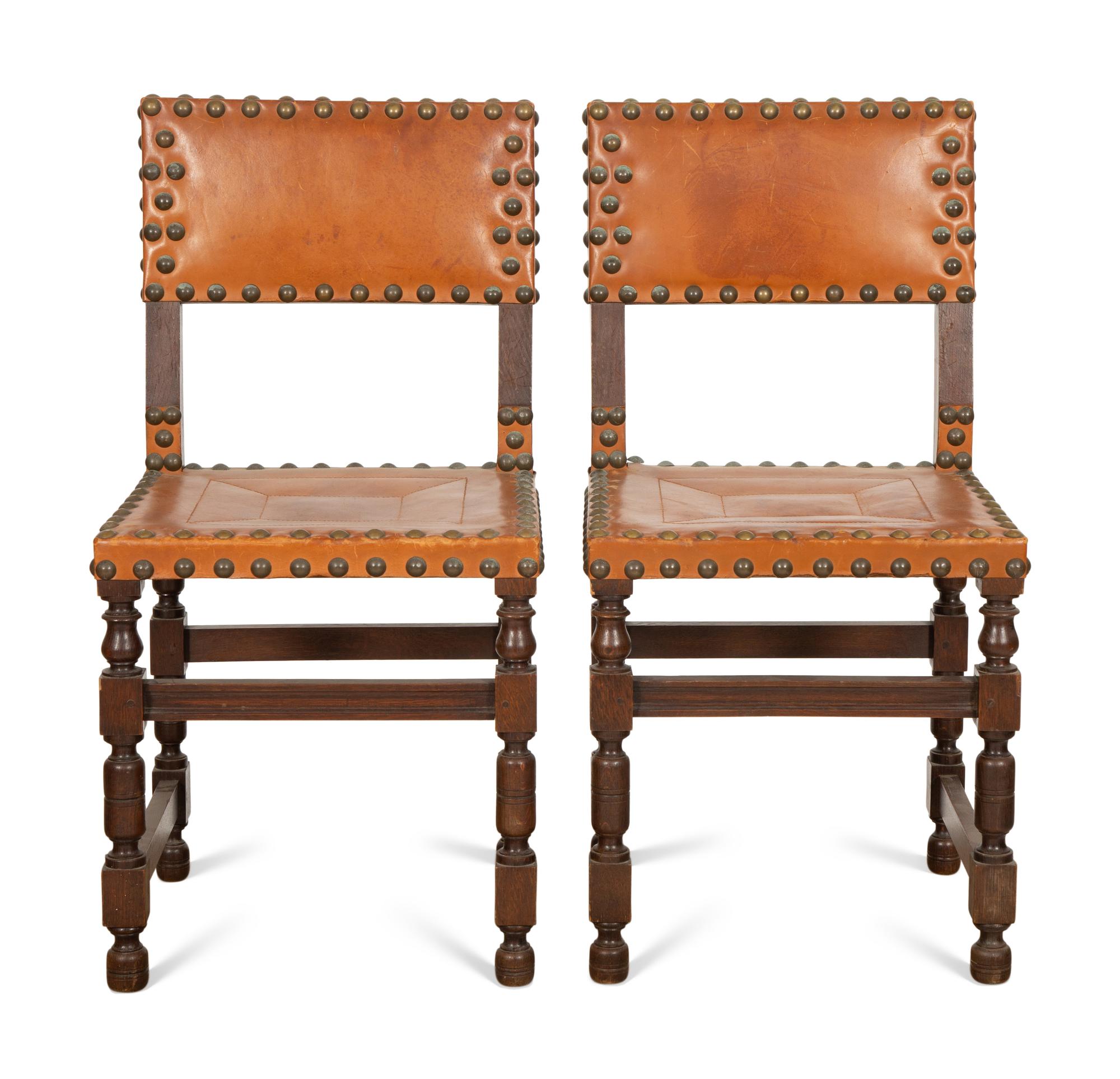 A Pair of Oak and Leather Side Chairs