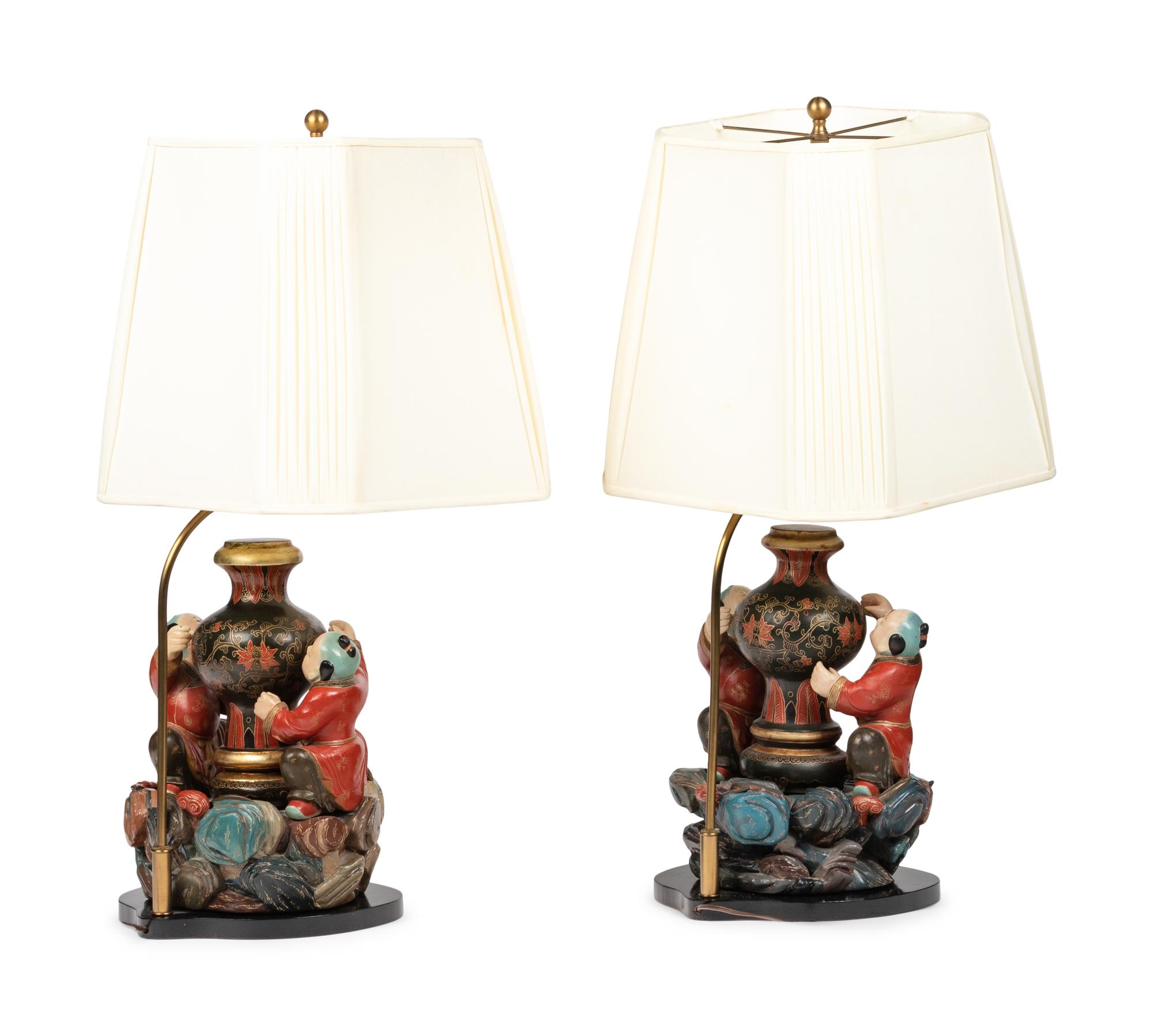 A Pair of Chinese Carved Wood Figural Lamps