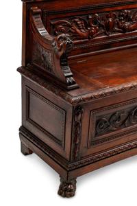 An Italian Renaissance Revival Carved Walnut Settle