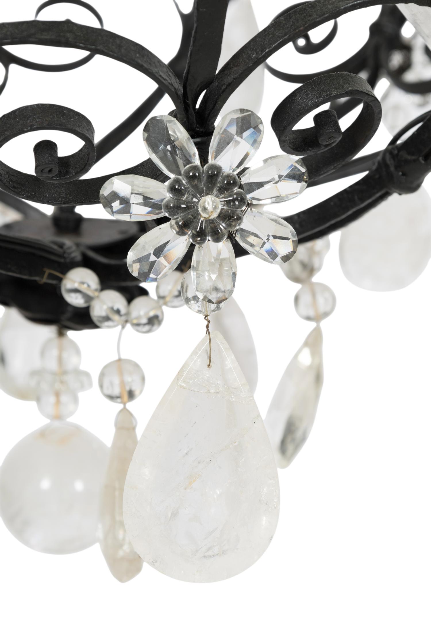 A Wrought Iron and Rock Crystal Twelve-Light Chandelier
