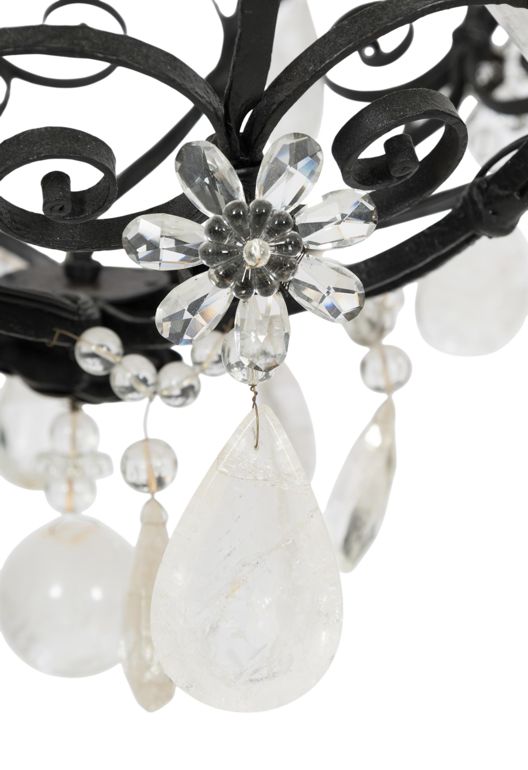 A Wrought Iron and Rock Crystal Twelve-Light Chandelier