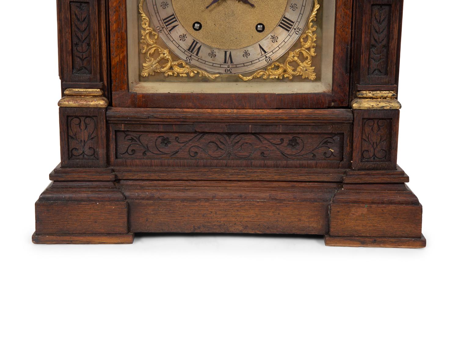 A Victorian Gilt Metal Mounted Oak Bracket Clock