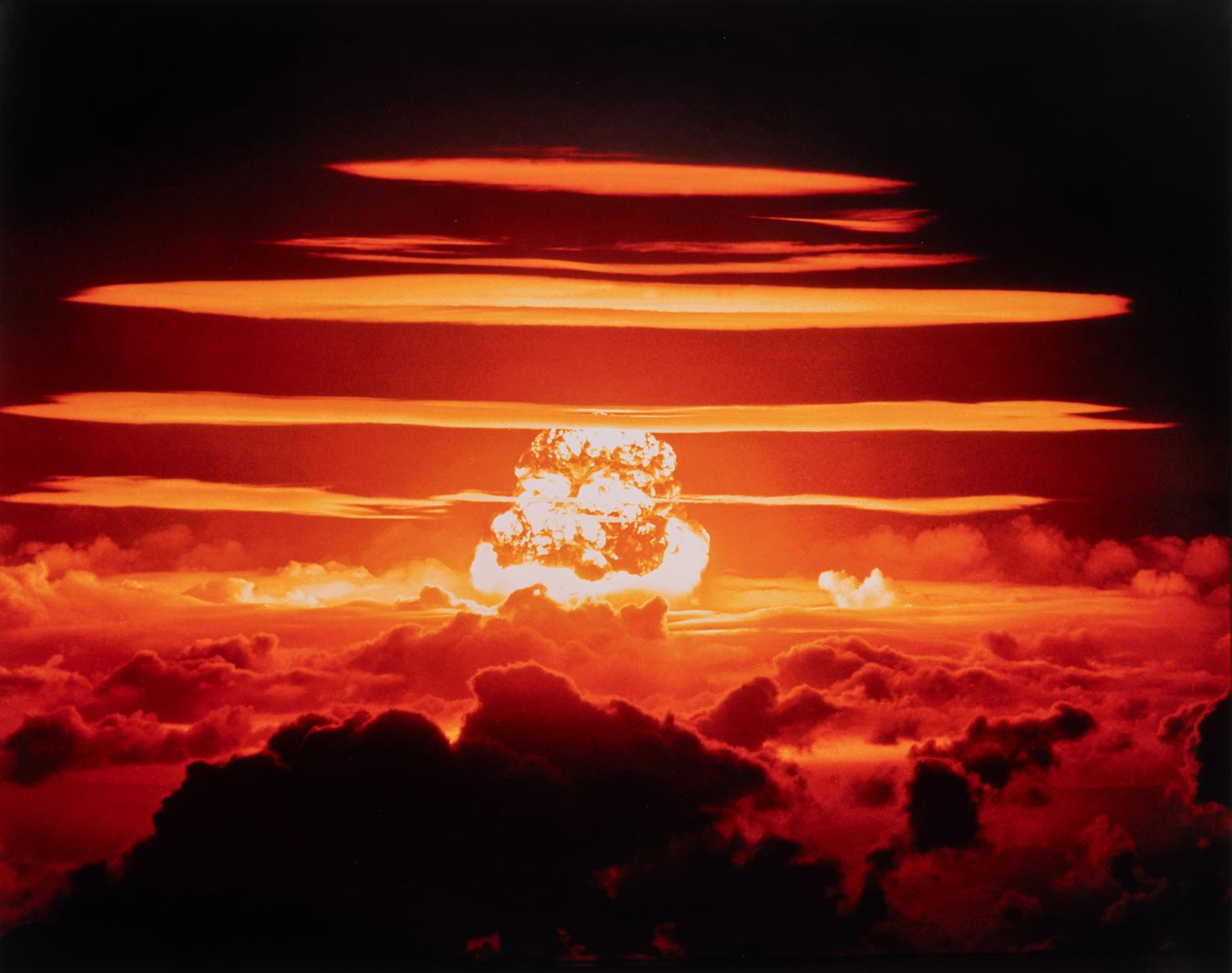 [OPERATION GREENHOUSE - DOG TEST]. Photograph of VIP observers lit up by the light of an atomic bomb on Enewetak Atoll 1951 (but printed 2009).