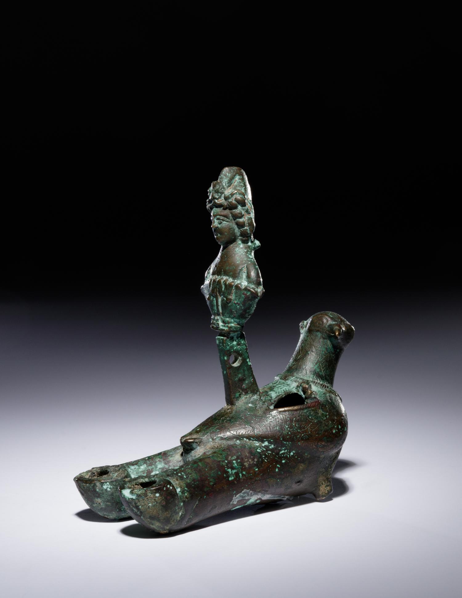 A Roman Bronze Oil Lamp in the Shape of a Dove with the Bust of a Goddess