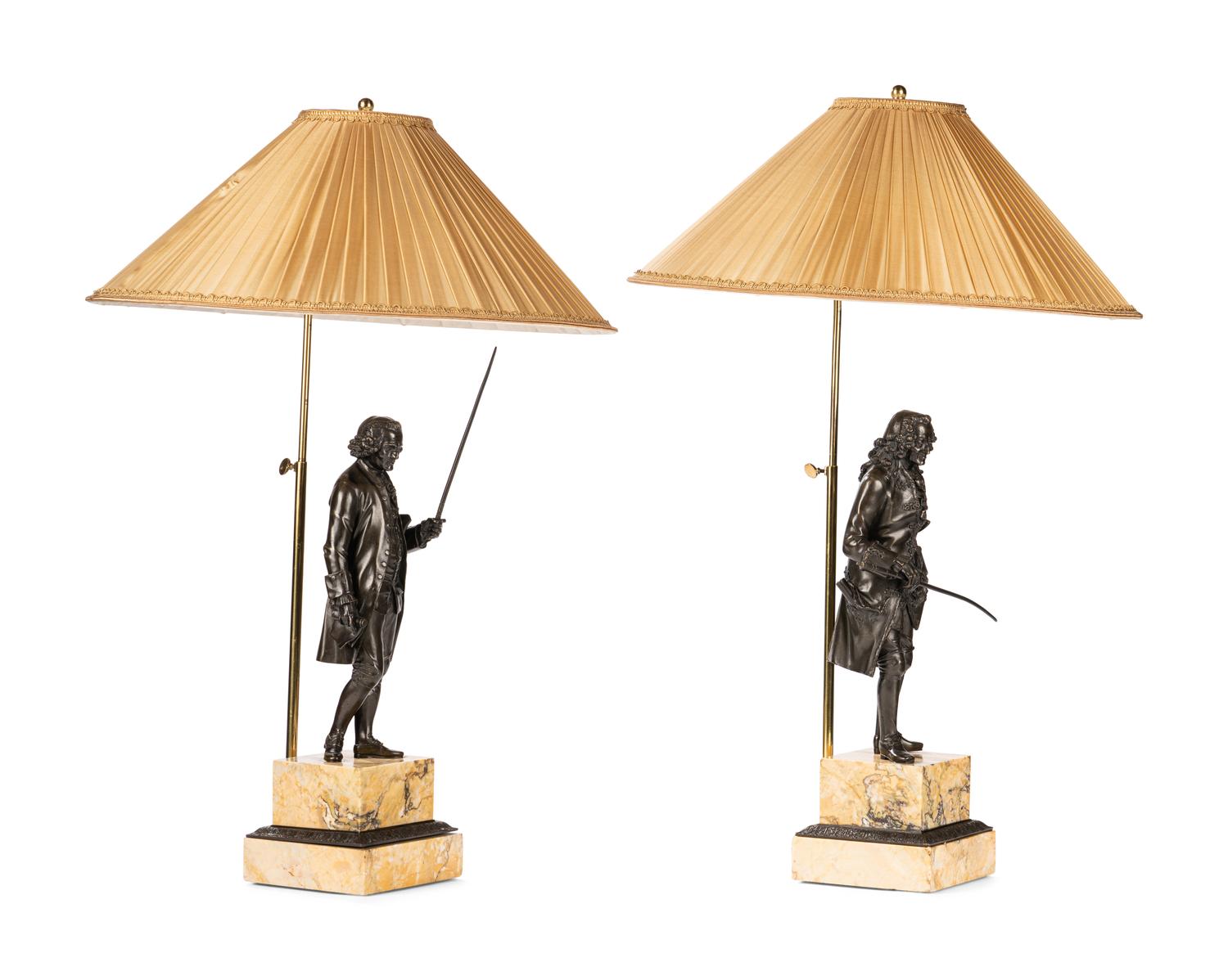 A Pair of French Bronze and Sienna Marble Sculptures of Voltaire and Rousseau
