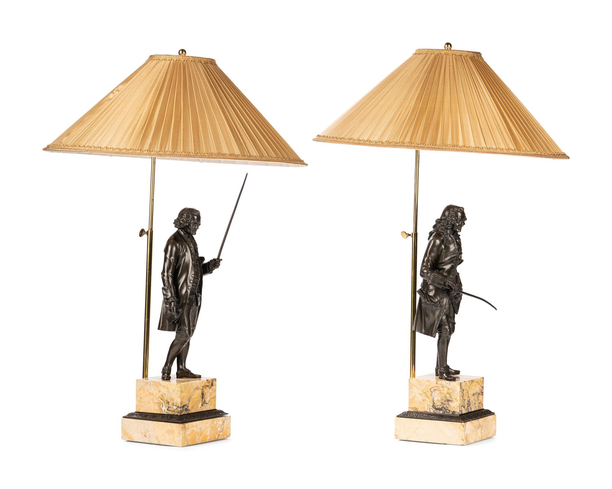 A Pair of French Bronze and Sienna Marble Sculptures of Voltaire and Rousseau