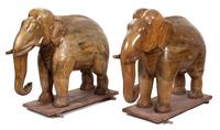 A Pair of Indian Carved Teak Models of Elephants Height 46 x width 23 x depth 52 inches.