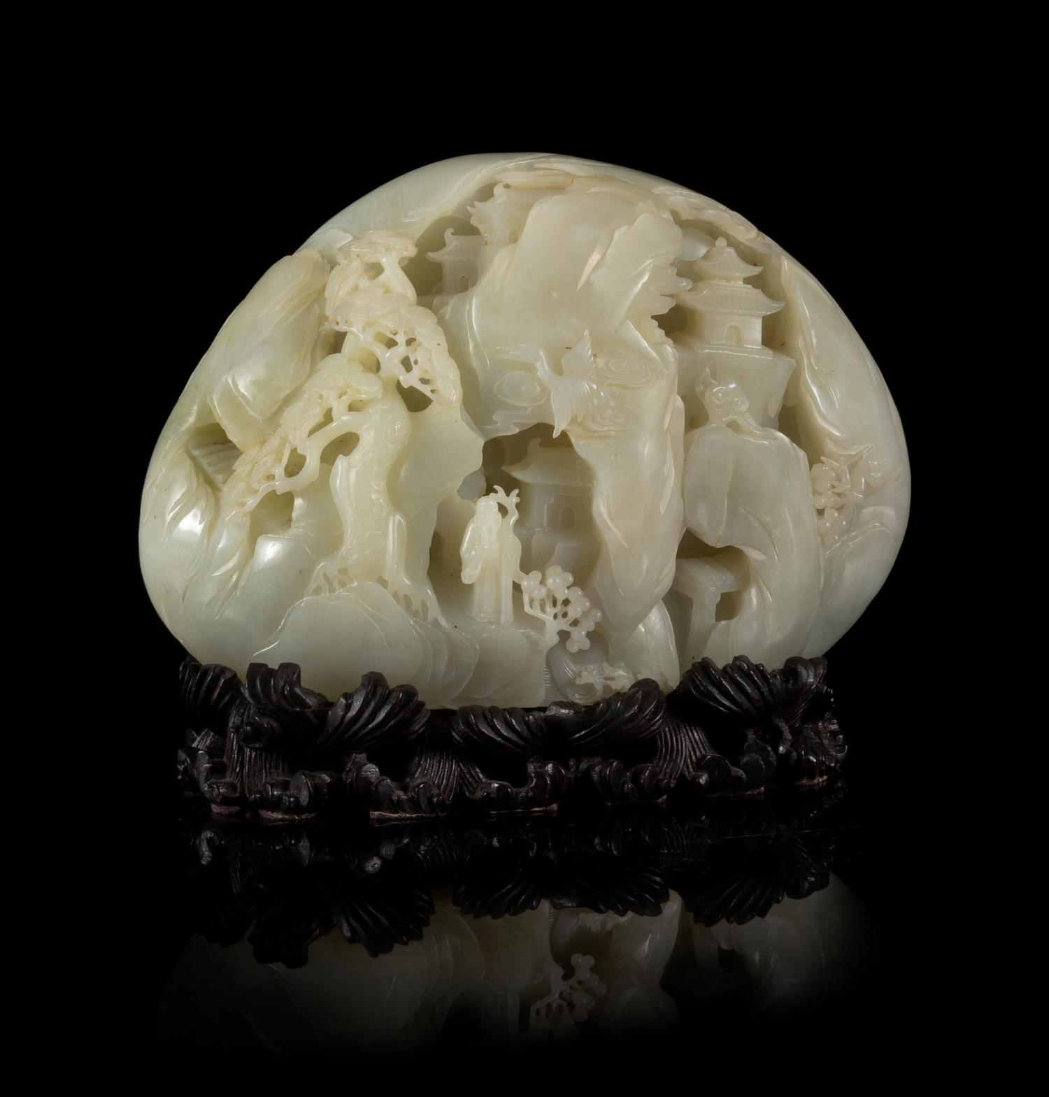 A Carved Pale Celadon Jade Boulder Height 7 x width 8 inches.