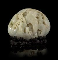 A Carved Pale Celadon Jade Boulder Height 7 x width 8 inches.