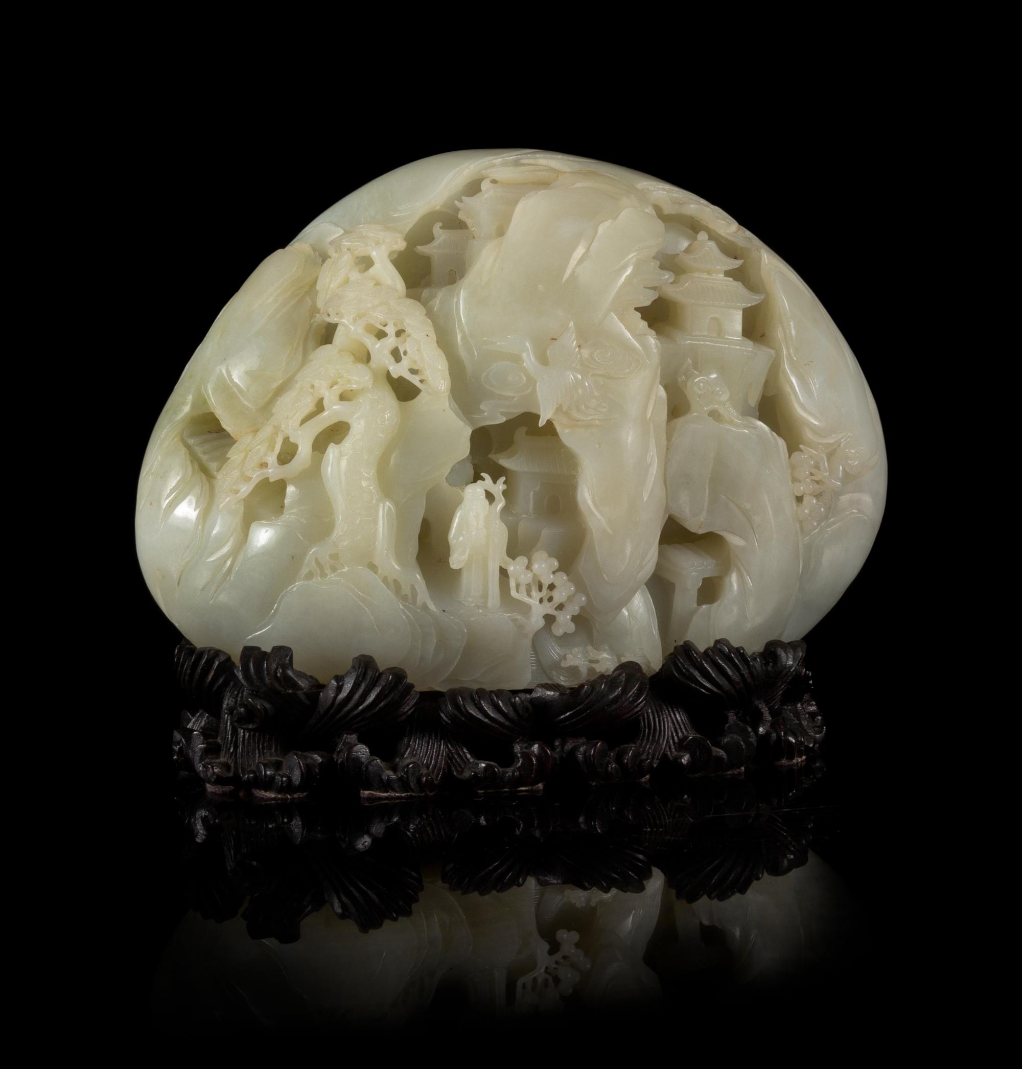 A Carved Pale Celadon Jade Boulder Height 7 x width 8 inches.