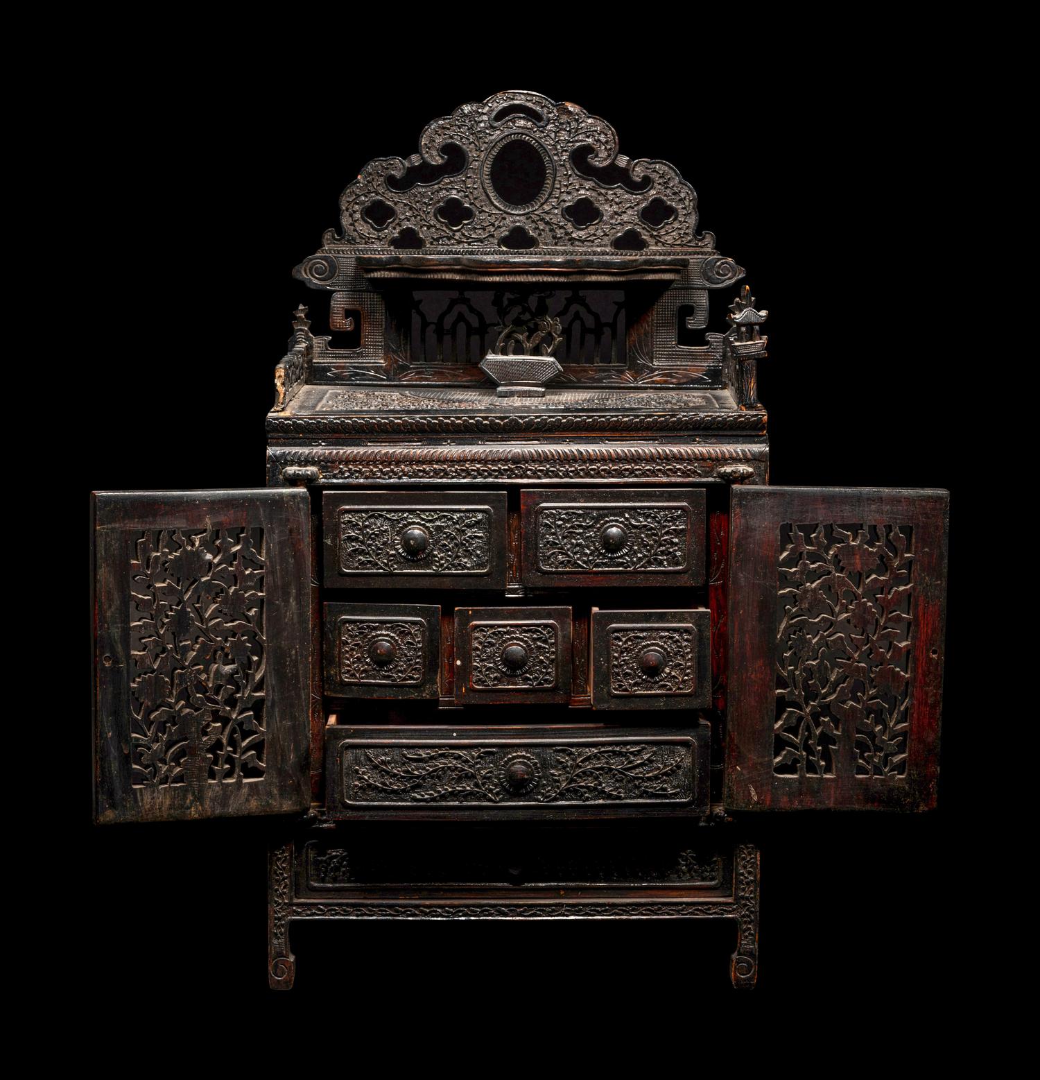A Chinese Export Carved Hardwood Cabinet