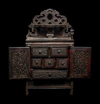 A Chinese Export Carved Hardwood Cabinet