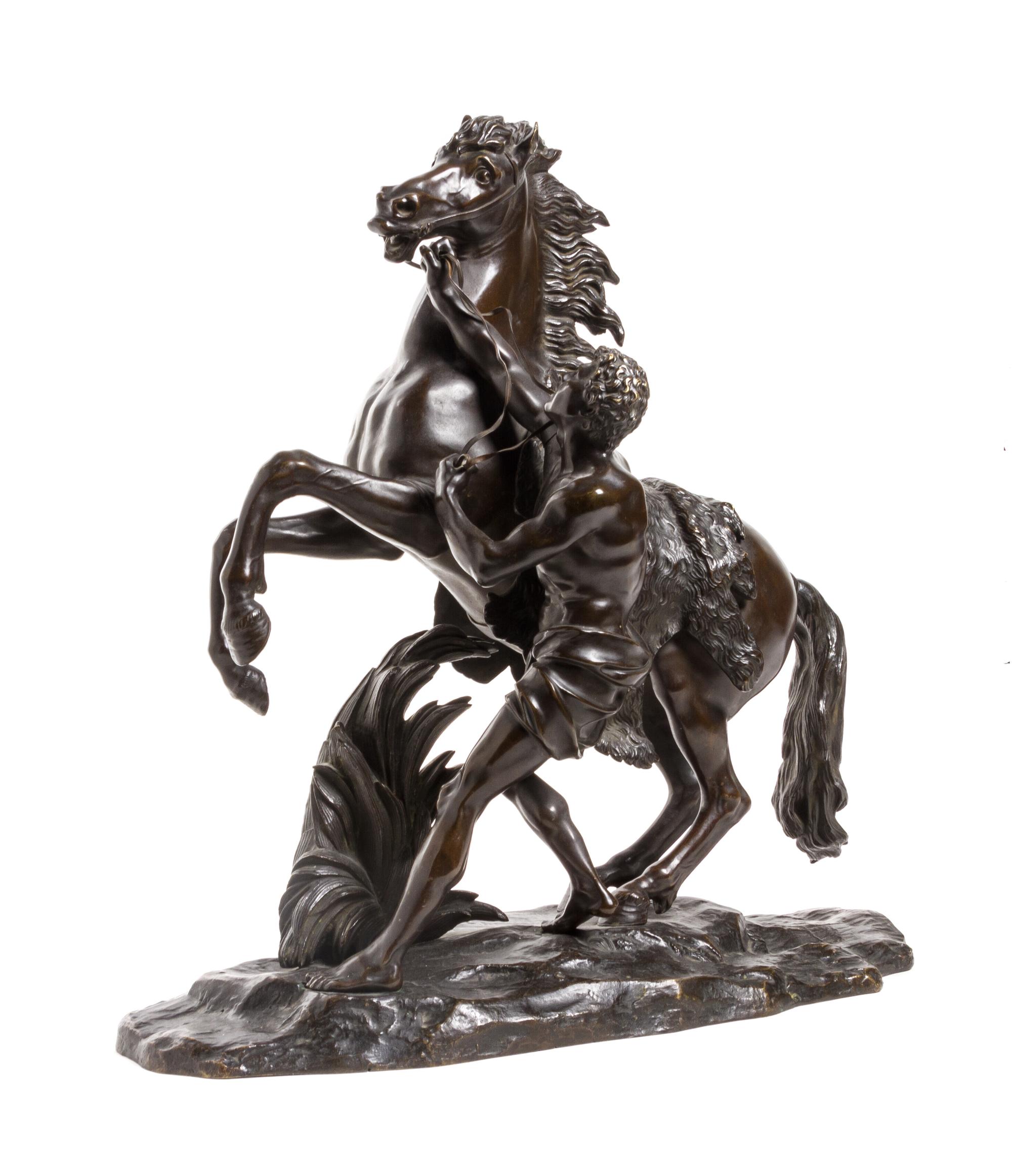 A Continental Bronze Figural Group, after Guillaume Cousteau, Height 22 inches.