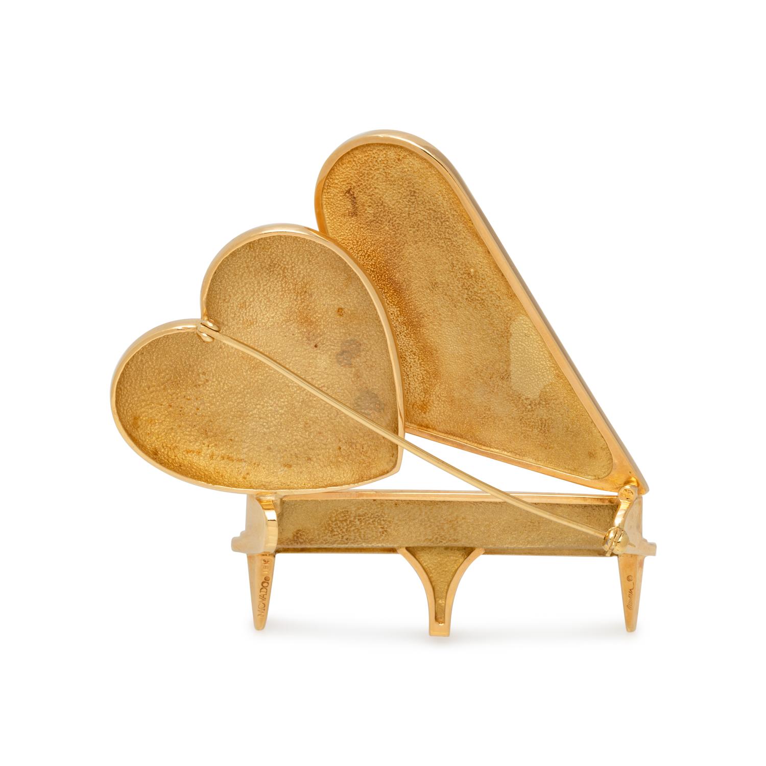 MOVADO, YELLOW GOLD PIANO BROOCH