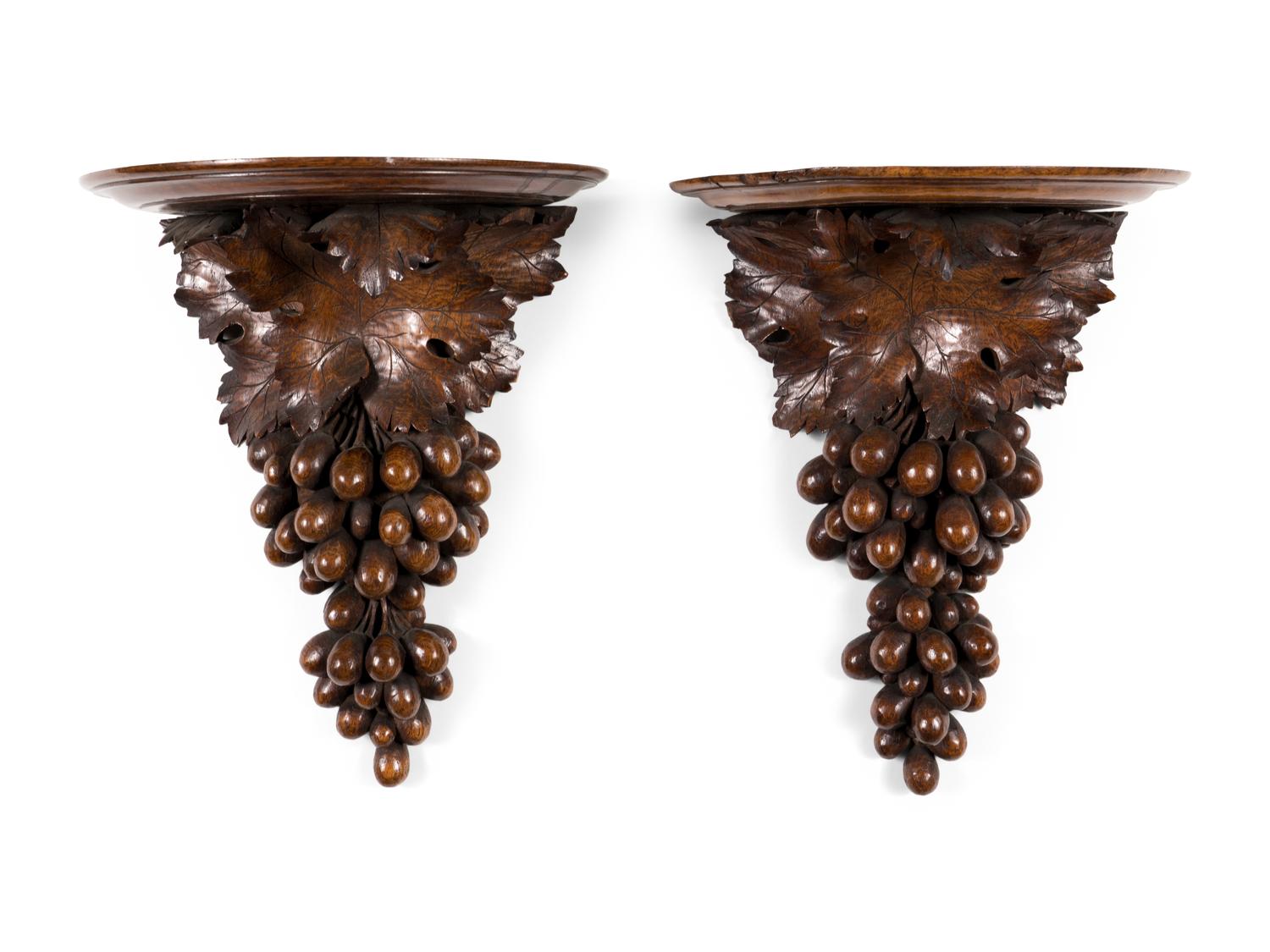 A Pair of Continental Carved Walnut Wall Brackets