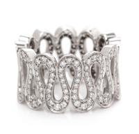 An 18 Karat White Gold and Diamond Wavy Band Ring, Boucheron, 7.10 dwts.
