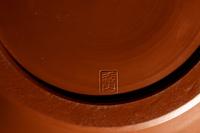 A Japanese Persimmon Glazed Pottery 'Landscape' Jar