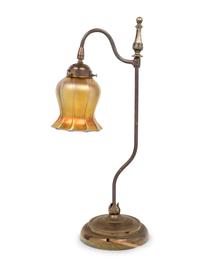 A Brass Table Lamp With Quezal Iridescent Glass Shade