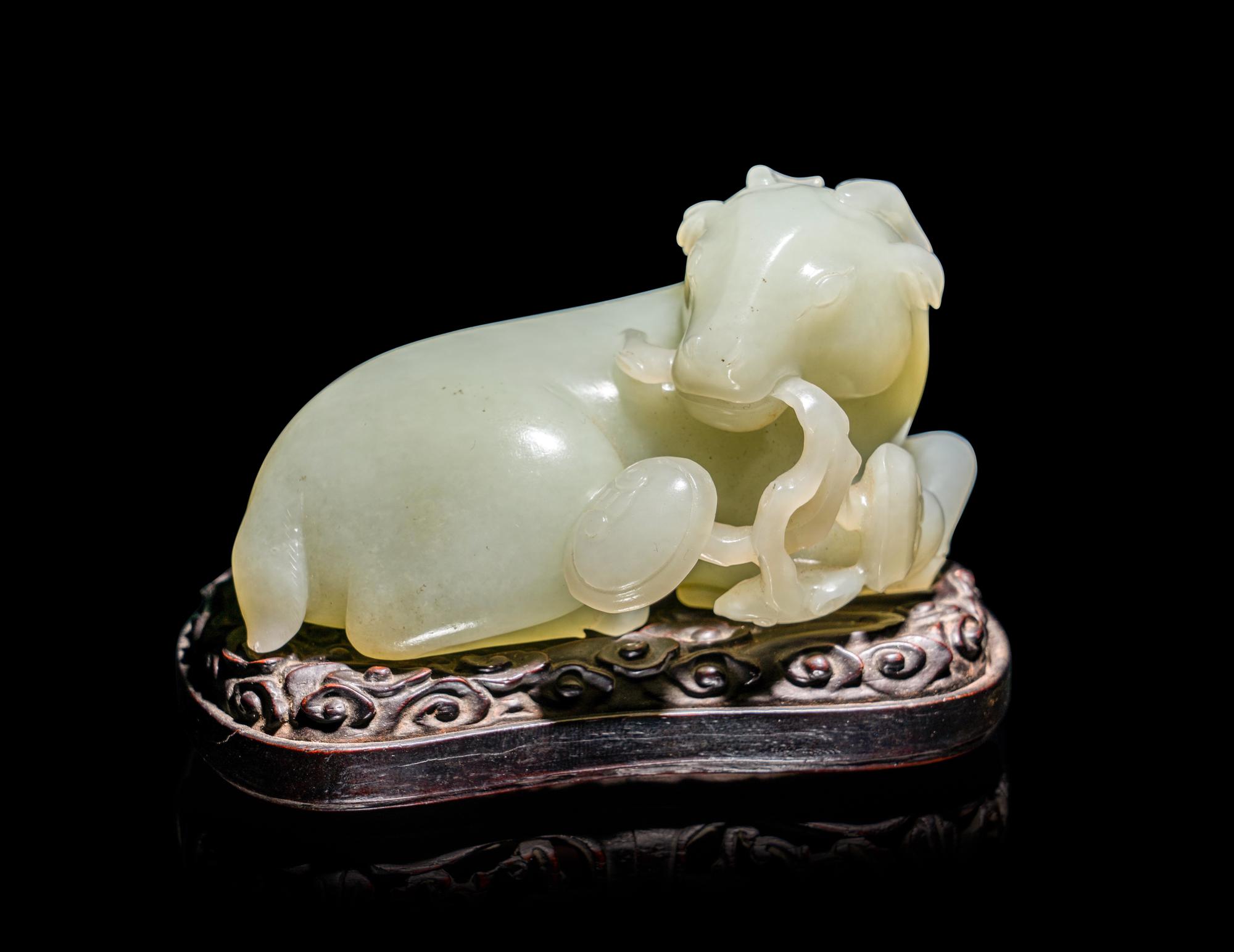 A Chinese Celadon Jade Figure of a Recumbent Ram
